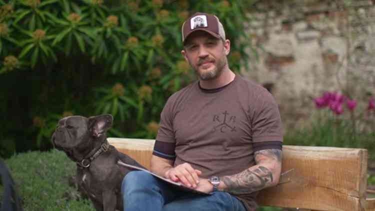 Richmond actor Tom Hardy reads bedtime stories from his garden alongside French bulldog Blue