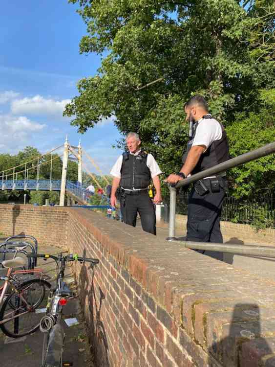 Two policemen guard the bridge at 7pm