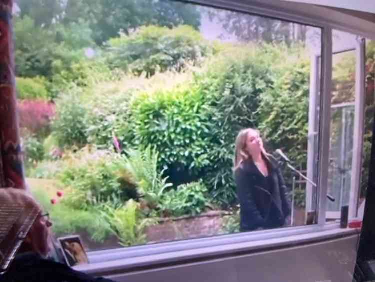 Morgan sings for her grandad through the window on his birthday