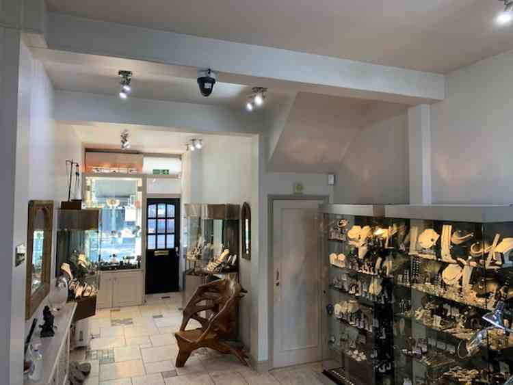 Inside the jewellers, one customer at a time and you must ring the bell for entrance