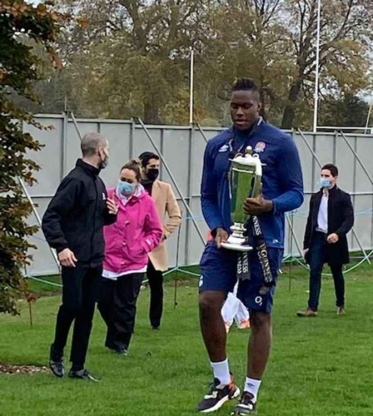 England forward Maro Itoje carries the Guinness Six Nations trophy after a medal presentation ceremony their Teddington HQ at the Lensbury Club