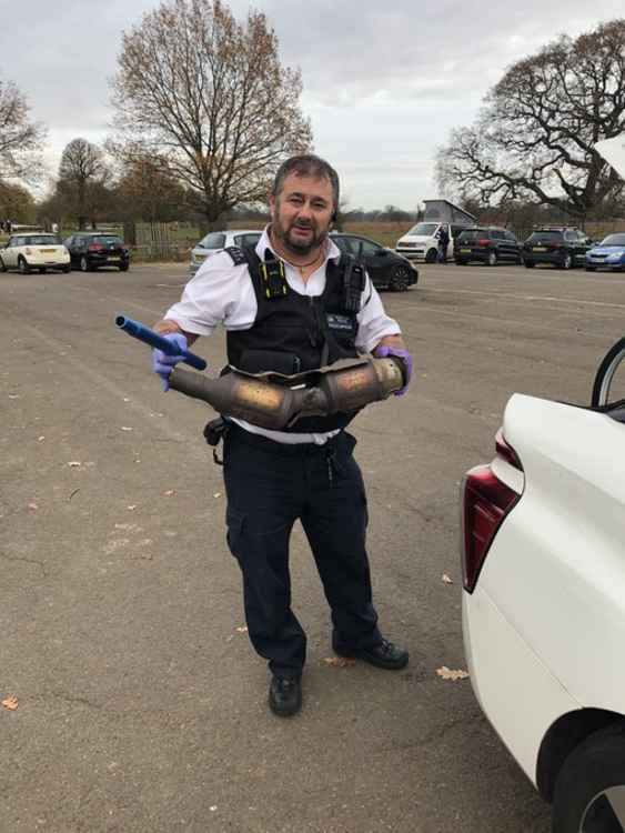 PC Parker with the stolen converter (credit: Teddington Police)