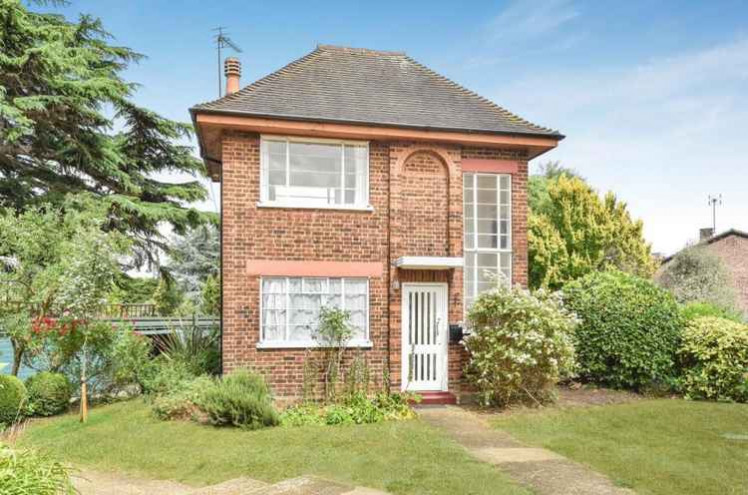 The exterior of the house, showing its 1930s brickwork and latticed windows / All photo credits Gibson Lane via Rightmove