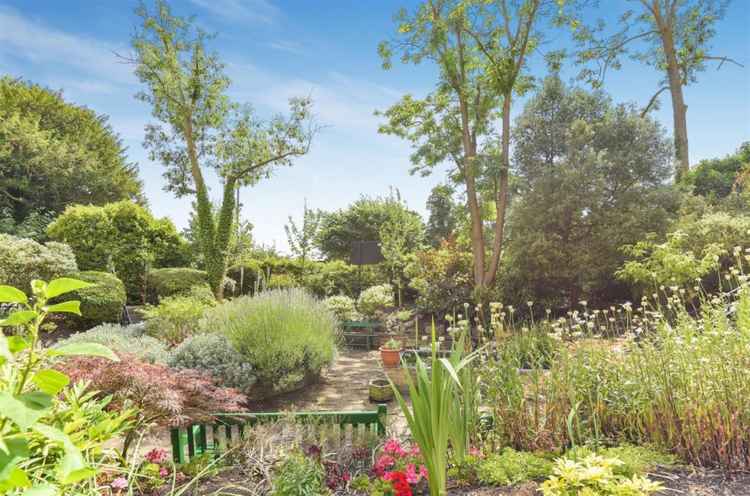 The house has access to a stunning landscaped garden, as well as the park