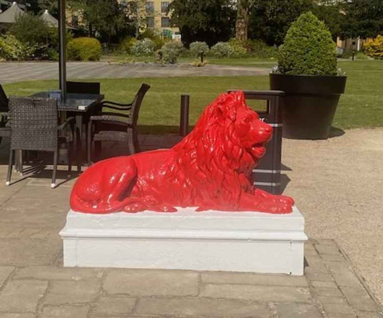 The clubs lions have been given a coat of striking red paint