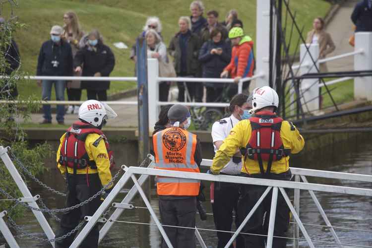 Crew members assisted medics when the whale got stuck