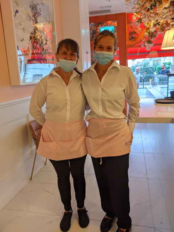 La Pesca's friendly waitresses wear smart pink aprons which match the interior design