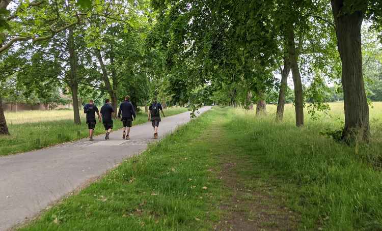 Crew members walk home after a day on set (Credit: Nub News)