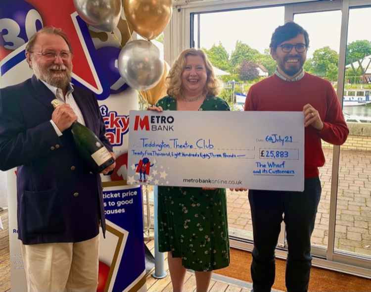 (L to R) Teddington Theatre Club President, Roger Smith, Chair, Cath Messum and finance director Joe Stockwell celebrate their lottery windfall at The Wharf today (Credit: Get Lucky Local))