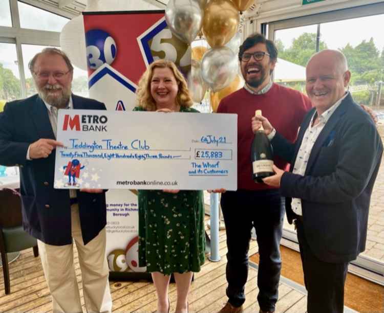 Get Lucky Local co-founder Mark Taylor (far right) hands over big cheque to Teddington Theatre Club (Credit: Get Lucky Local)