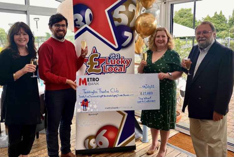 Manager of The Wharf, Debbie Waldouck toasts the Teddington Theatre Club lottery jackpot today  (Credit: Get Lucky Local)