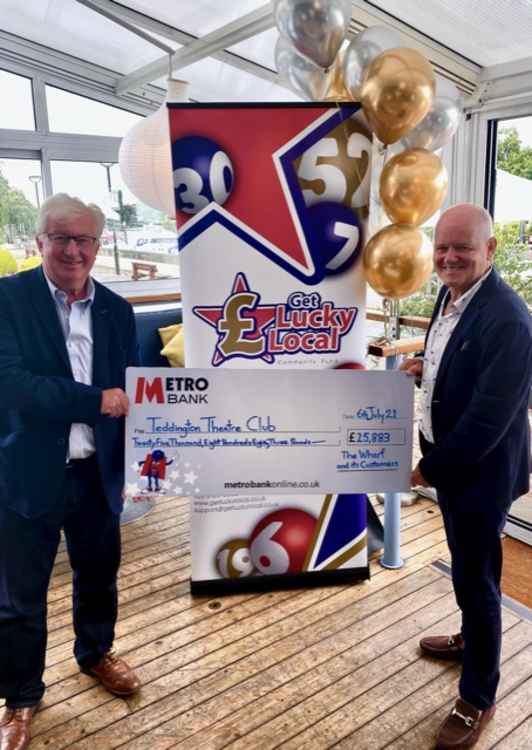 Get Lucky Local co-founders Stuart Higgins (left) and Mark Taylor hand over the jackpot cheque today (Credit: Get Lucky Local)