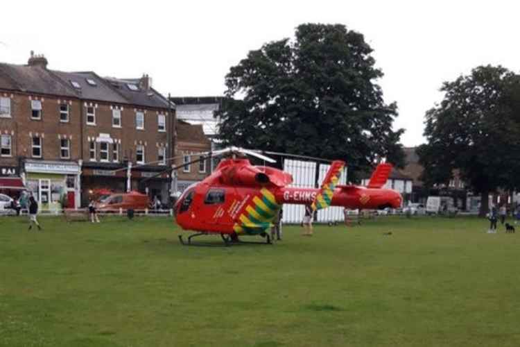 An air ambulance was seen landing on Twickenham Green as medics rushed to help the victim