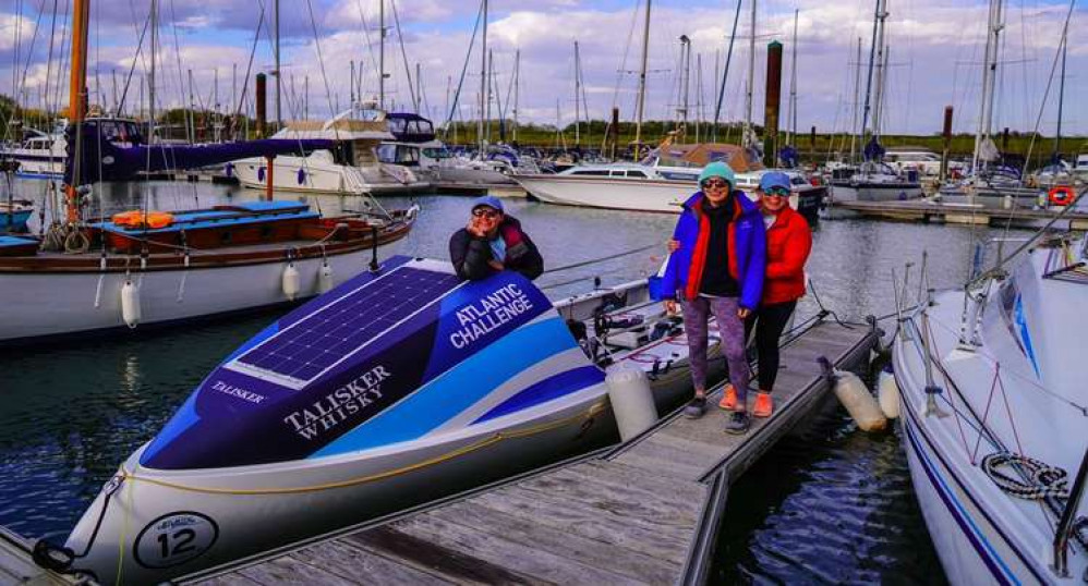 From left to right, Charlotte, Kat and Abby aboard the 23 foot boat called Dolly which they will row 3000 miles across the Atlantic