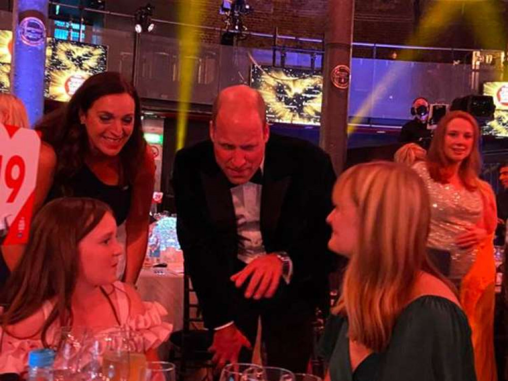 Teddington charity Park Lane Stables co-founder Natalie O'Rourke and her daughter Alice chat to Prince William at the event (Image: Park Lane Stables)