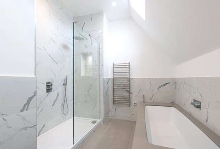 But the house has been modernised as this trendy marbled bathroom shows (Image: Hamptons)