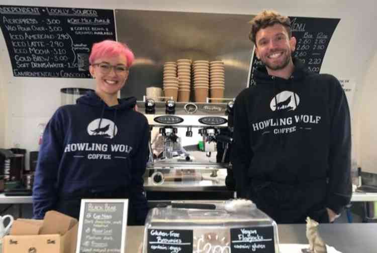 Rochelle Van Der Merwe and James Cady in their Howling Wolf Coffee trailer on Honiton High Street