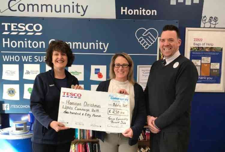 Pictured: Gill Reed - Tesco Honton, Michelle Pollington - Honiton Town Council and Duncan Sheridan-Shaw representing both.