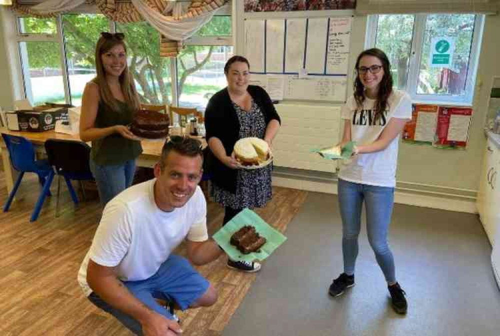 Staff at Honiton Primary School enjoying cake delivered by The Lacemakers Café