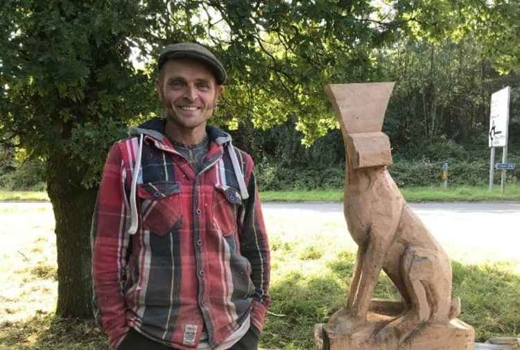 Simon with a carving of a hare he is currently working on