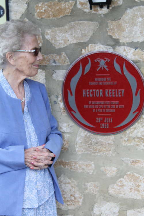 Daphne by the plaque that honours her father