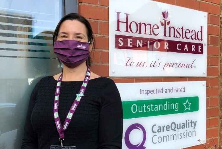 Home Instead member of staff wearing the CARE badge