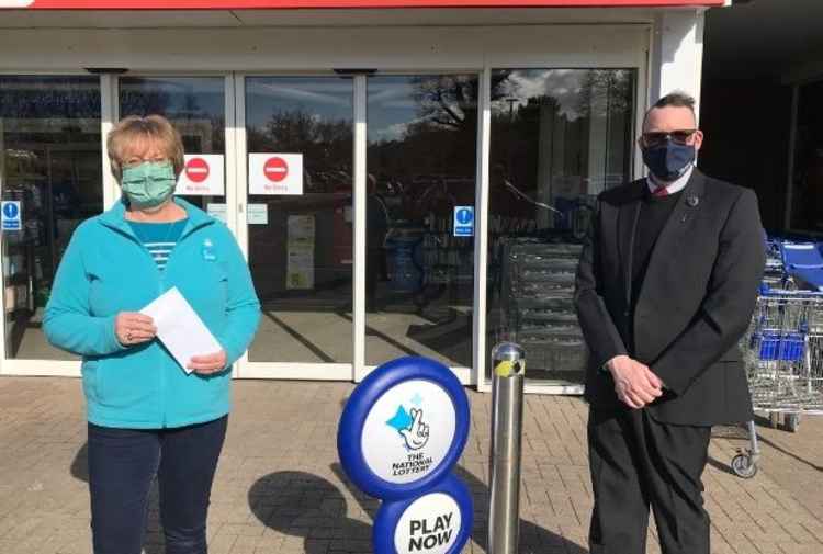 Chair of Honiton Dementia Action Alliance, Heather Penwarden with Tesco Community Manager, Duncan Sheridan-Shaw