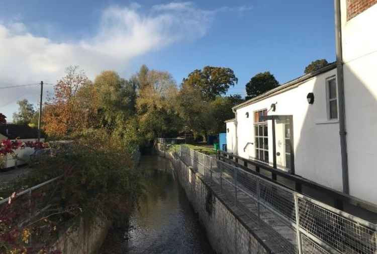 River Gissage flowing under the High Street at the bottom of town