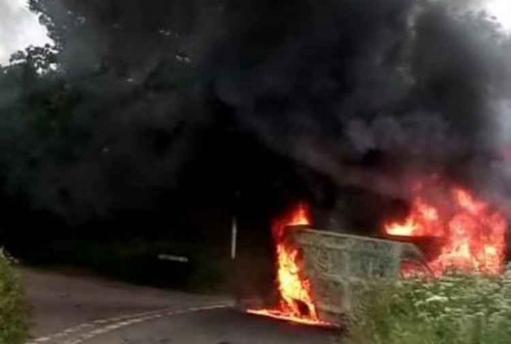 Dramatic photo of the van on fire. Picture by Ottery Fire Station