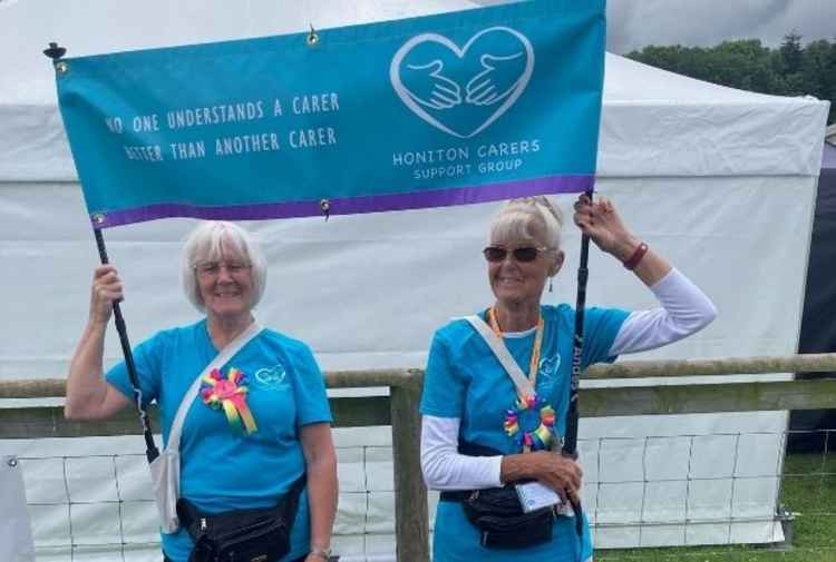 Valerie Lloyd and Winnie Cameron with their Carers Support banner