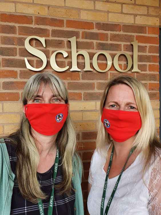 Staff at St Joseph's Catholic Primary School with their Devon Freewheelers face masks. Photo: St Joseph's Primary School