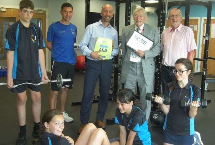 Andy Taylor, head of sport and PE department (in blue T-shirt), Glenn Smith, headteacher, Richard Allen, RALPHH, Tony Smith, chairman of governors, and pupils