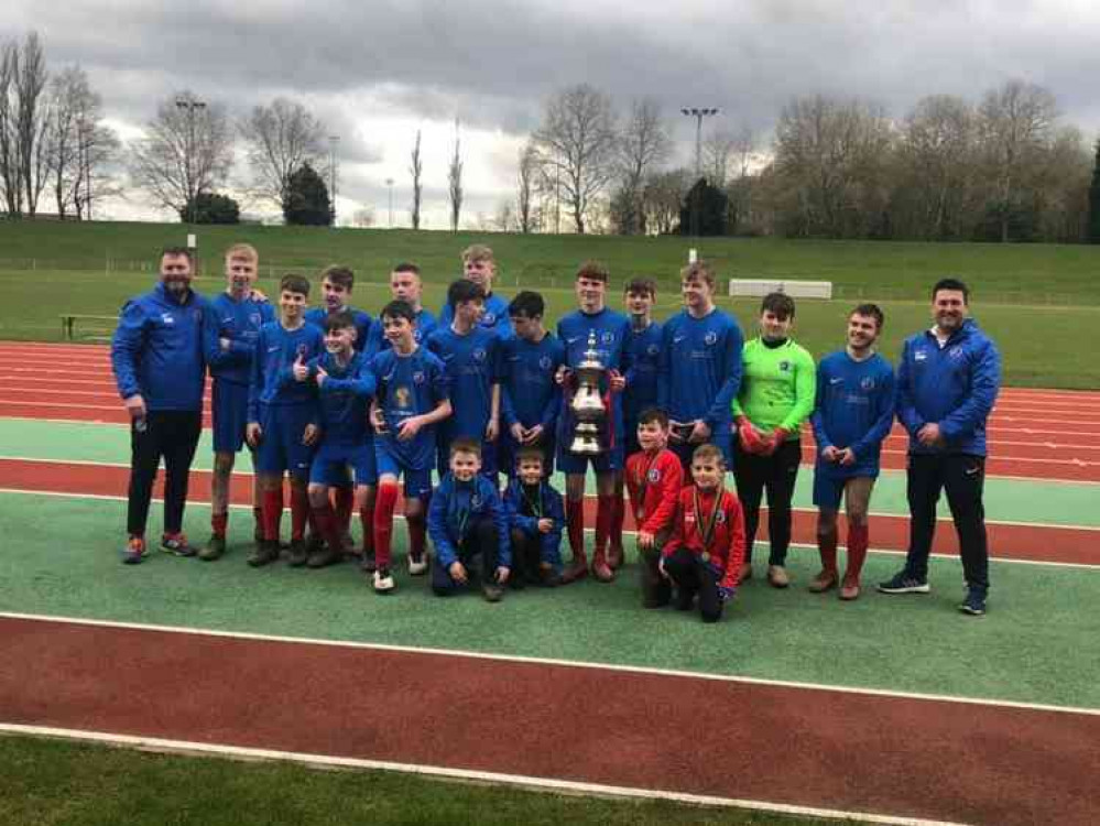 Ashby Ivanhoe Under-15s with the trophy after beating Rolleston on penalties