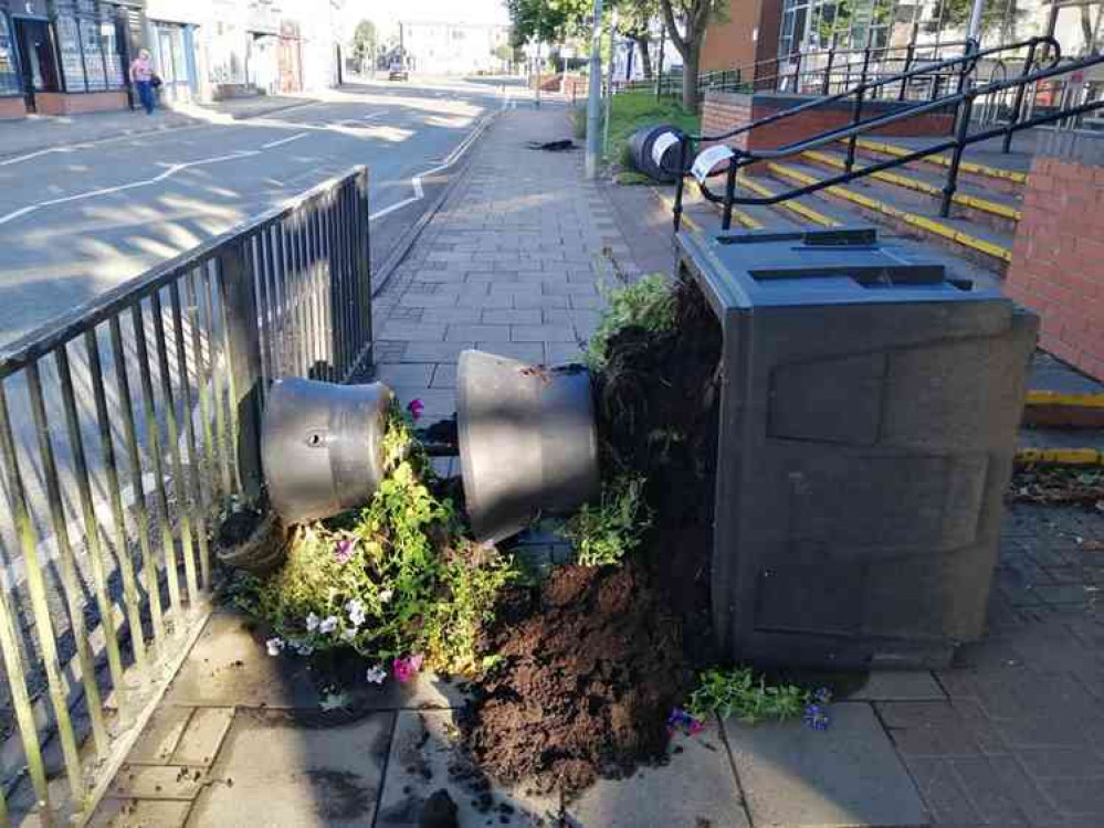 Plants and their holders were tipped up during the vandalism which took place last weekend. Photo: Terry Taylor