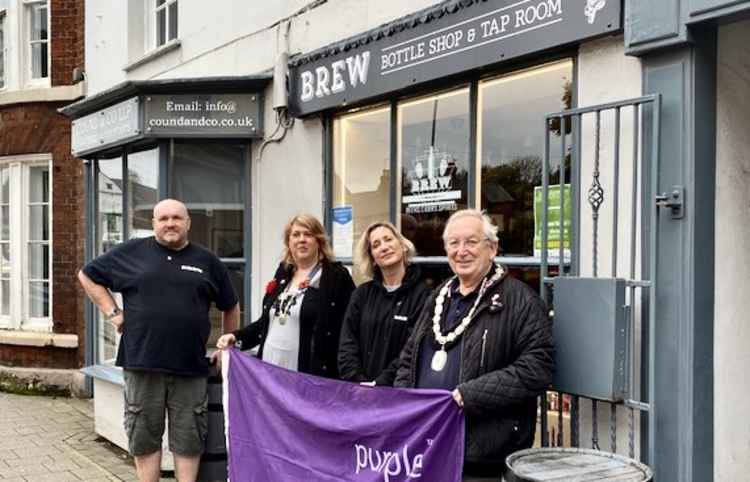 John and Laura McEntee outside Brew with the Mayor of Ashby, Cllr Graham Allman, and Local Mind Co-ordinator Amanda Shakespeare
