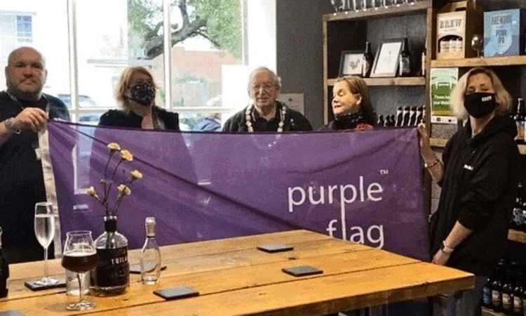 Brew's owners inside the Market Street bar with the Mayor and Mayoress of Ashby