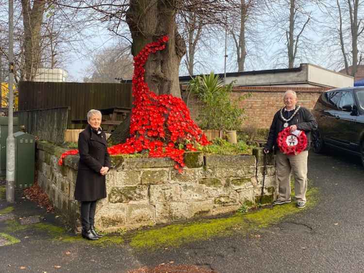 Ivanhoe Club steward Karen Deakin and Ashby Mayor Graham Allman next to the poppy display