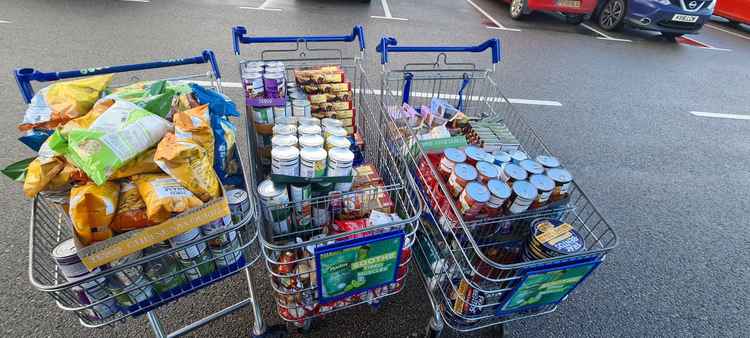 The tins were loaded in baskets for Ashby Food Bank
