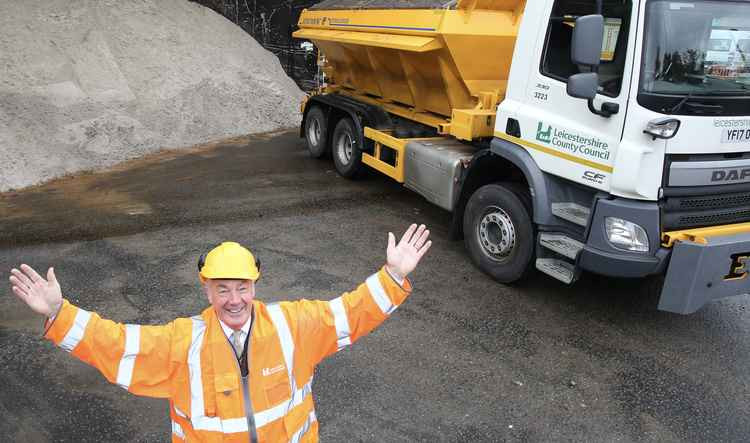 Cllr Trevor Pendleton with a county council gritter and salt stock pile - Ashby roads are being treated following the snowfall