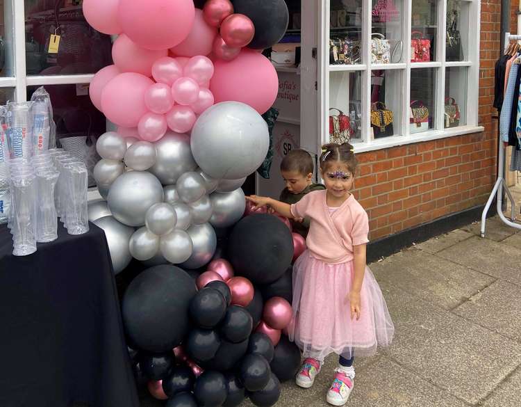 Two of Vas and Kalitsa's children on the store's opening day