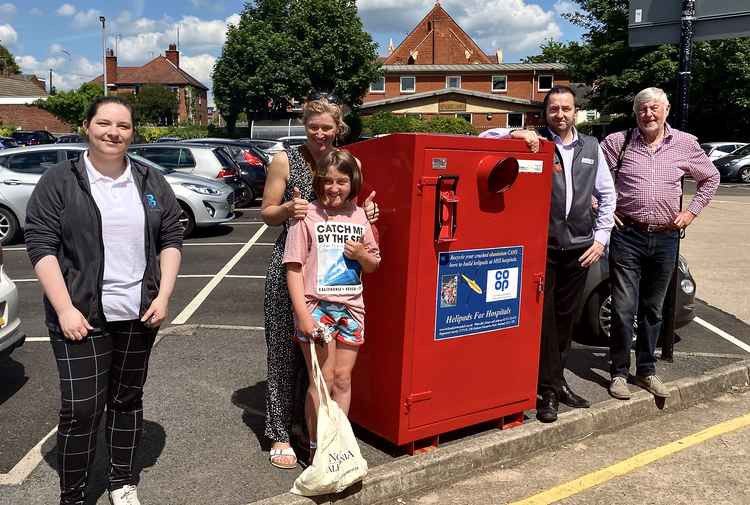 Launching Ashby's Big Red Bin are (l-r): Ashby Co-op Member Pioneer Zoe Richardson, Jo Warburton (Love Ashby Litter Picking Heroes), her daughter Matilda, Ashby Co-op store manager Richard Walton and Helipads for Hospitals Founder John Nowell