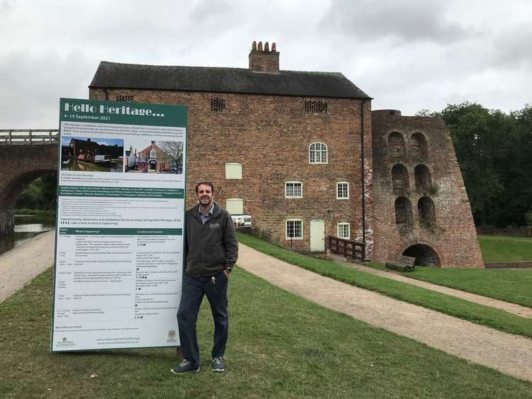 Tom Phillips, Site Manager at Moira Furnace Museum and Country Park with a Hello Heritage board