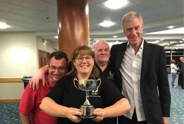 Sidmouth Town Band Basses holding the silverware