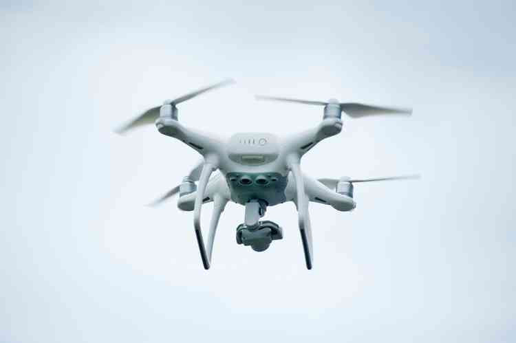 A White Quadcopter Drone. Image courtesy of Vision Pic.