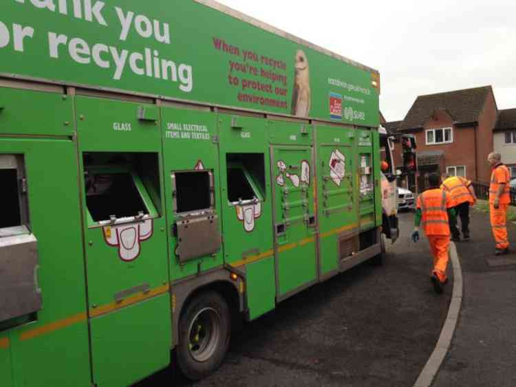 An East Devon District Council recycling lorry in action. Image courtesy of EDDC.