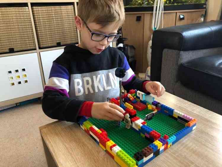 Freddie Taylor, 5, with his Lego Nightingale Hospital.