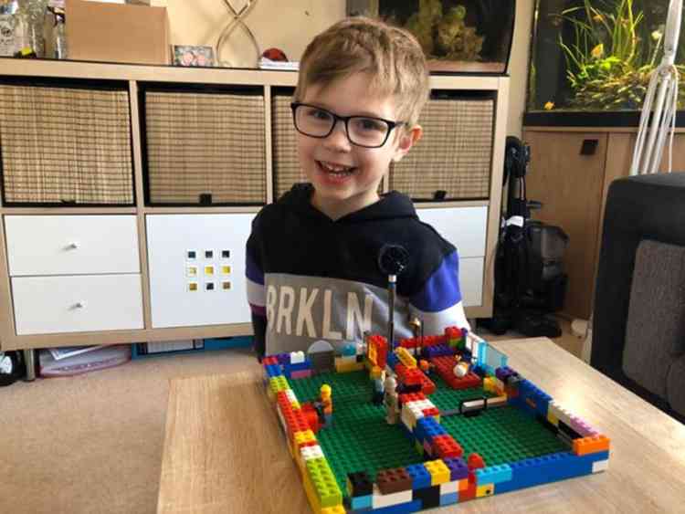 Freddie Taylor, 5, with his Lego Nightingale Hospital.