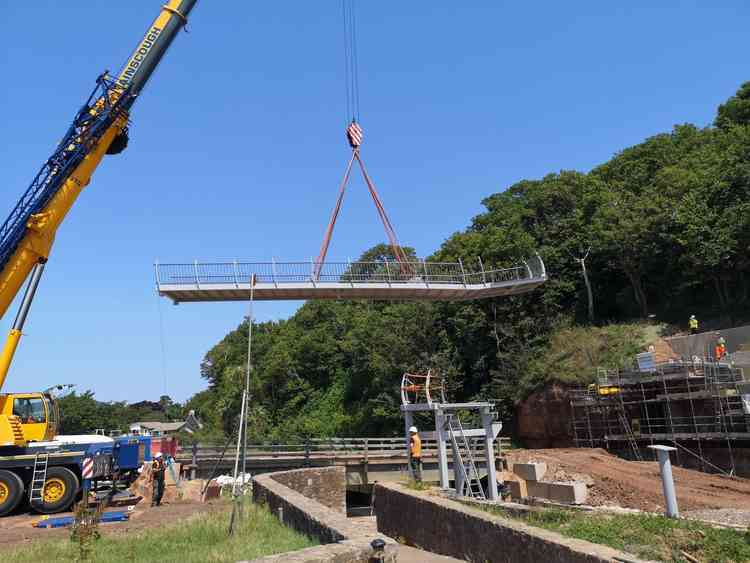 Key structures being moved into place before the bridge lift. Images courtesy of DCC.