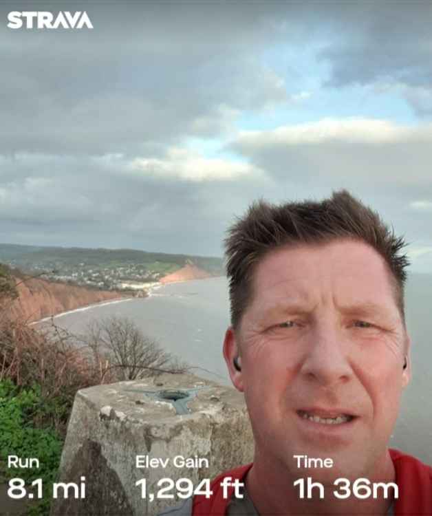 Allan Kay at the top of High Peak trig