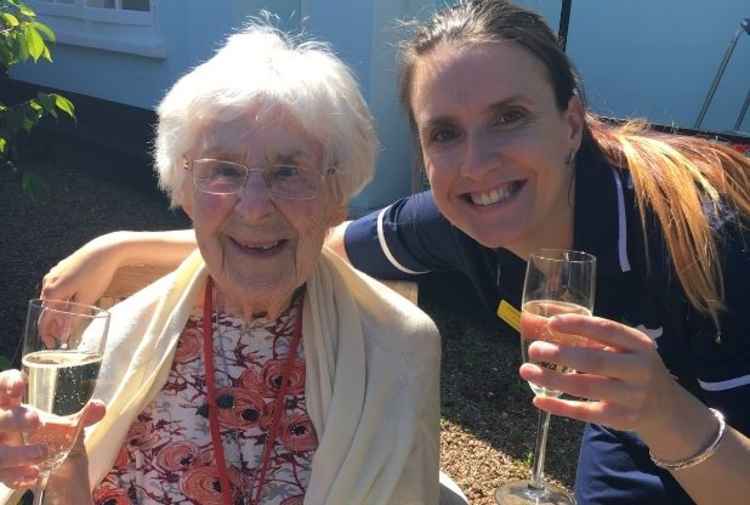 Senior Manager Samantha Evens celebrates Arcot House's five 'Outstanding' ratings with resident Eileen.